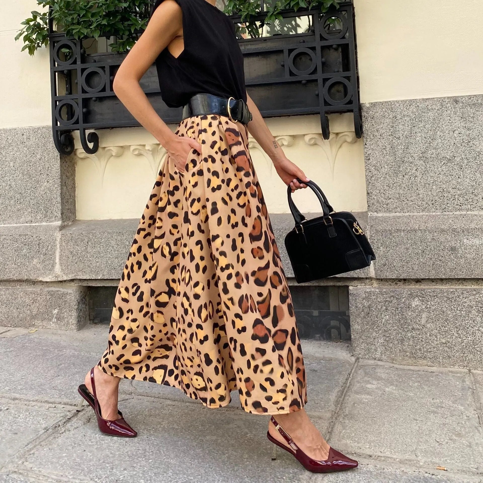 Brown leopard print women's A-line skirt with long length and big hem detail