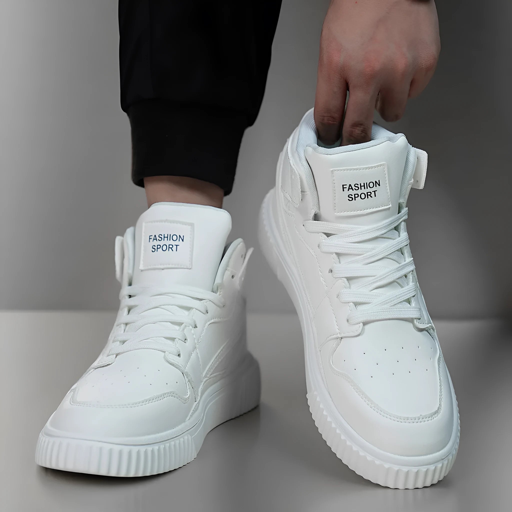 Men's white round-toe casual shoes with microfiber uppers on a plain background.