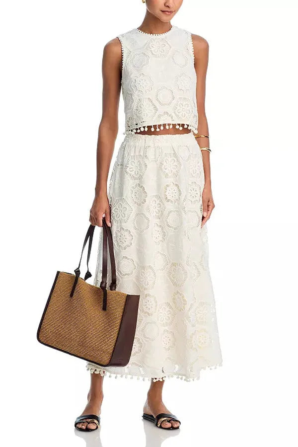 White women's sleeveless top and long skirt suit set with embroidery detail in retro art style