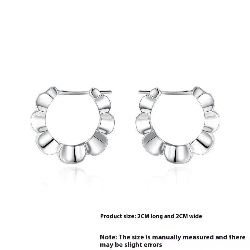 Silver geometric hoop earrings with round elements and retro styling