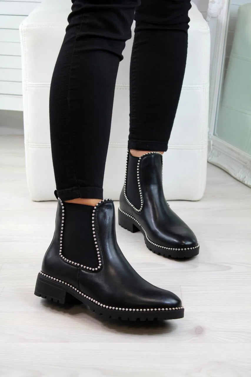 Women's short Martin boots in black PU sheep pattern with round toe and rubber sole