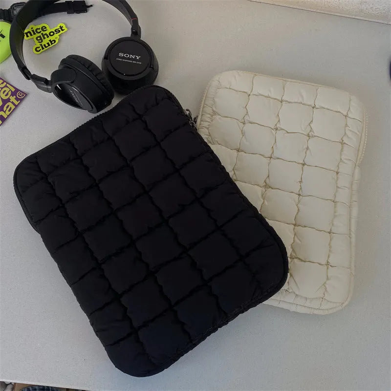 Black nylon laptop bag with cloud cotton interior padding shown next to a white version, sized for a 15.6-inch laptop.