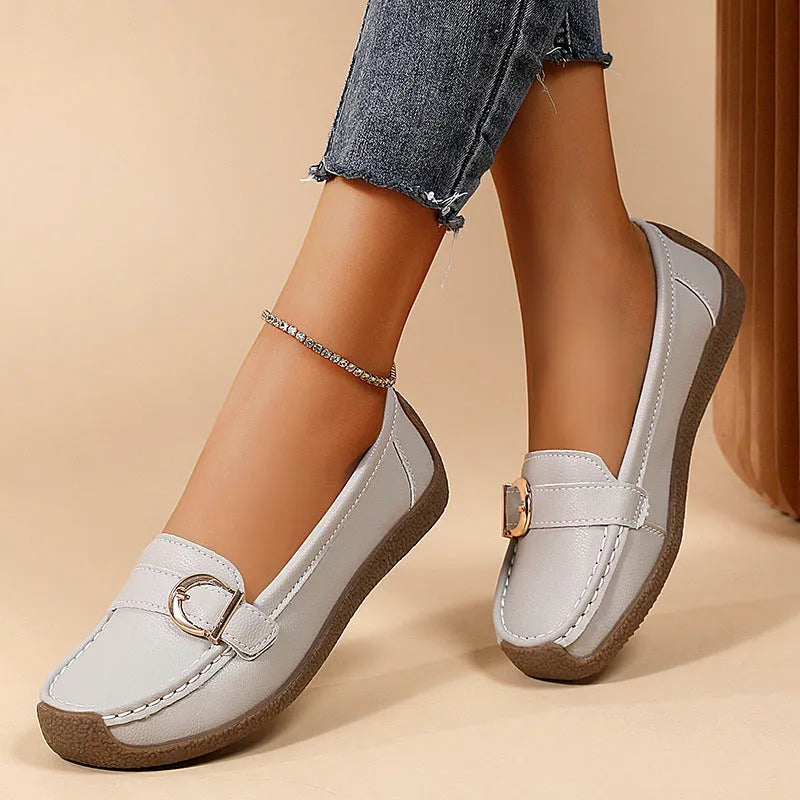 Women's beige casual loafers with a round toe and shallow slip-on design on a soft beef tendon sole.
