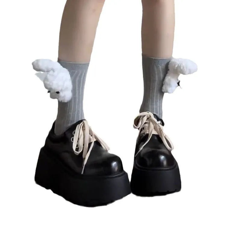 Women's matte black lace-up shoes with a high muffin heel and thick rubber sole.