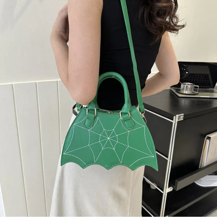 Women's small square PU saddle bag with spider web pattern, crossbody strap, and top handle, available in six colours including black and red