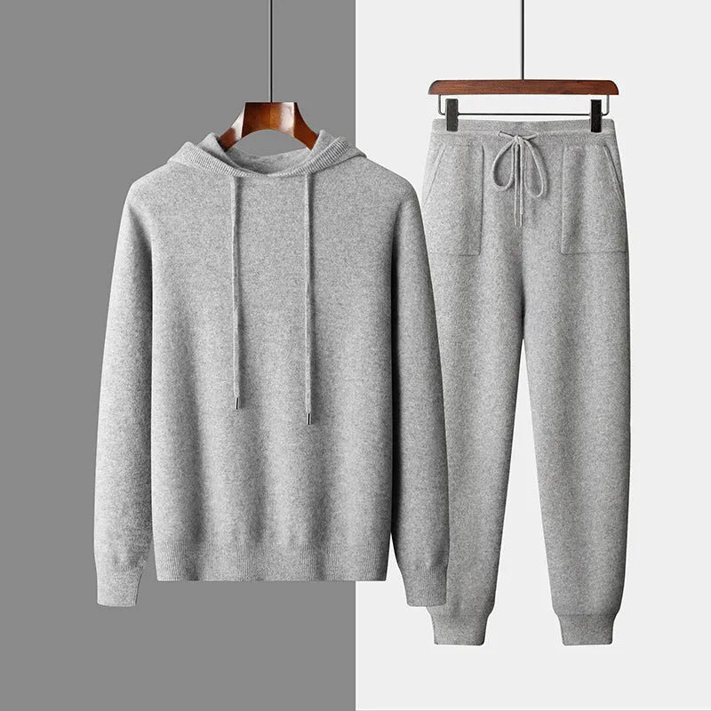 Men's light grey cashmere hooded sweatshirt and matching long pants set laid flat.
