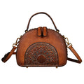 Vintage-style suede cowhide leather handbag with multiple internal organisation pockets.