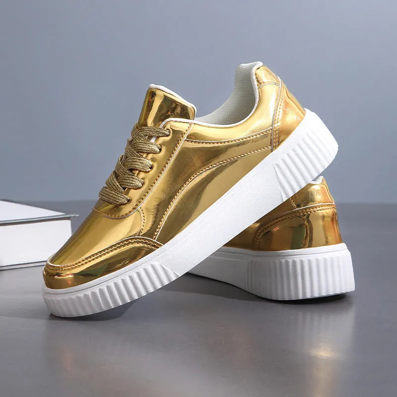Thick-soled sequin sneakers in metallic rose gold with platform heel and round toe