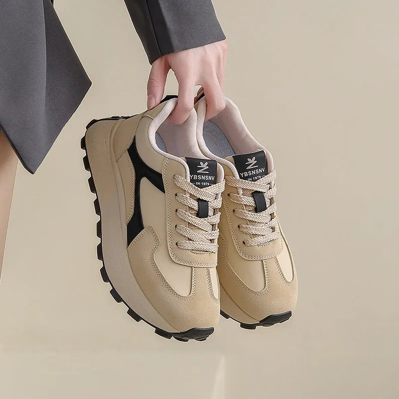 Women's low-top platform running shoes in black, red, or grey with lace-up front and flat rubber sole.