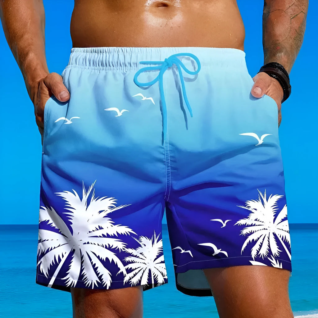 Man's ethnic style loose fit swimming trunks in a solid colour on a neutral background.
