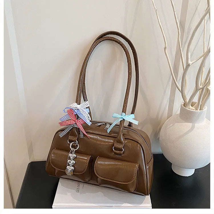 Retro brown PU leather pillow-shaped women's handbag with a flap and double shoulder strap