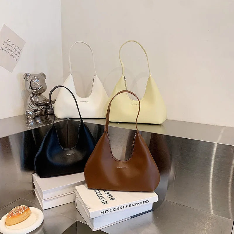 Retro style cream yellow PU shoulder handbag with single strap, sandwich pocket, and stitching detail.