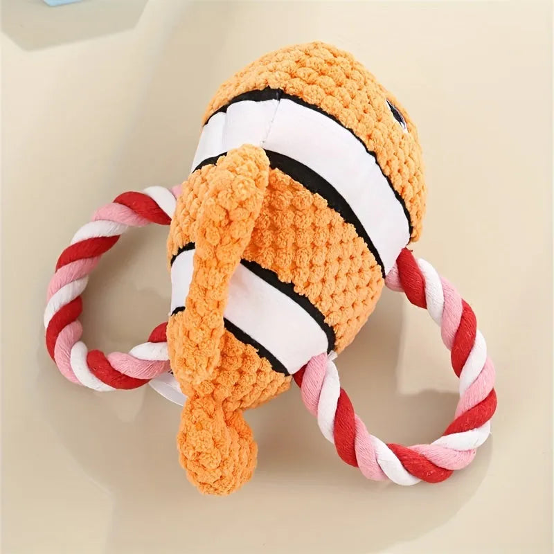 Grey turtle-shaped plush dog chew toy with textured knots on its shell.