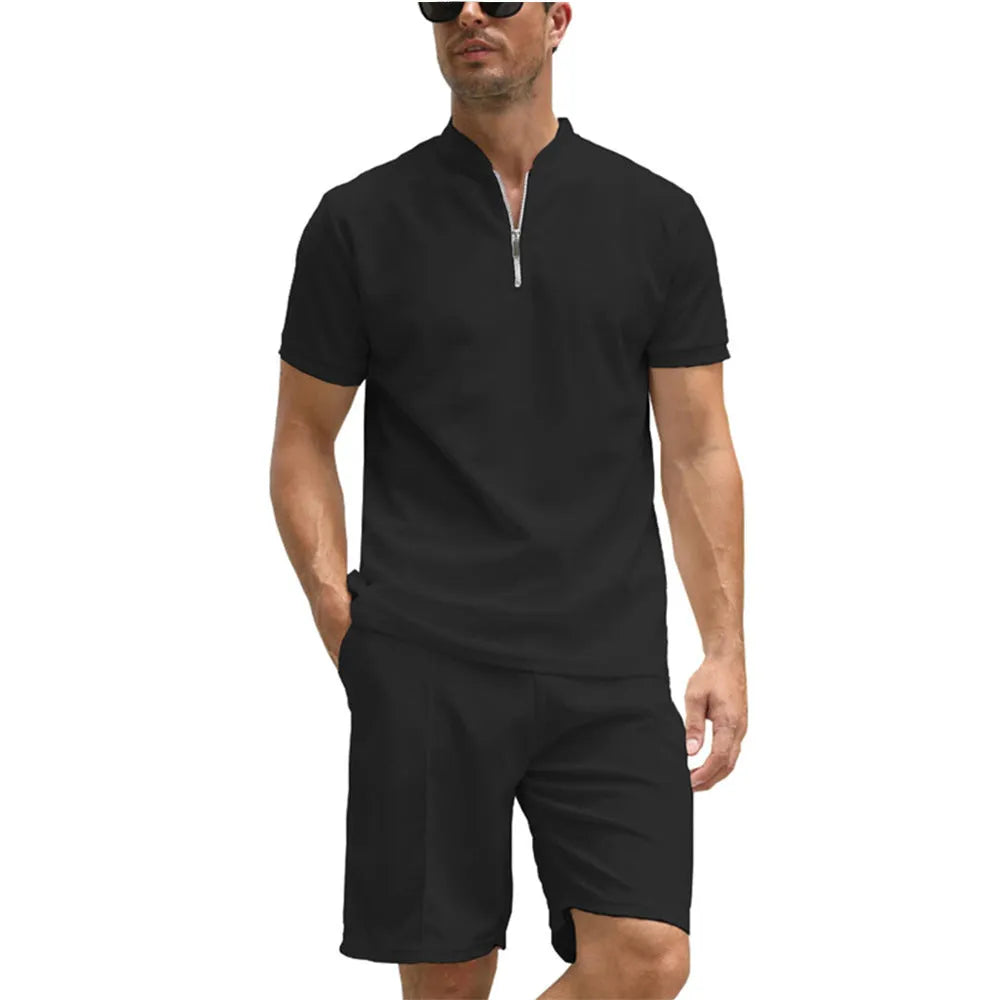Man wearing a solid colour polo shirt and matching trousers from a two-piece set in beaded bird's eye polyester fabric.