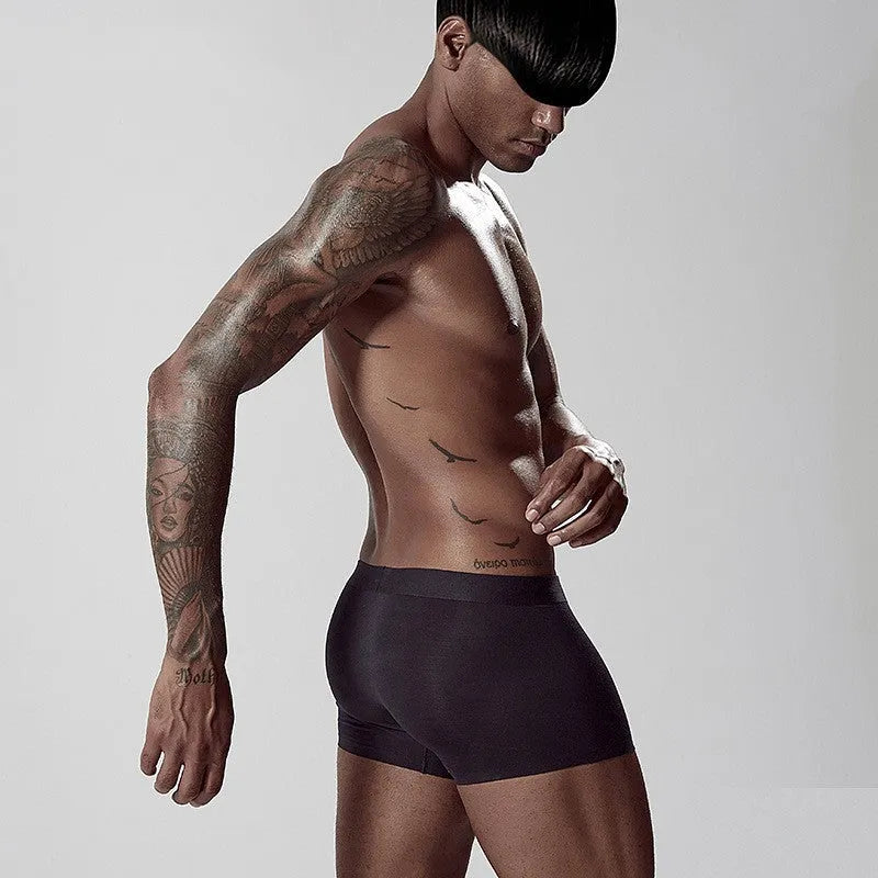 Seamless one-piece men's underwear in modal fabric showing mid waist design