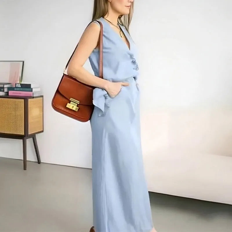 Women's blue loose vest and long skirt two-piece sleeveless suit set on a hanger