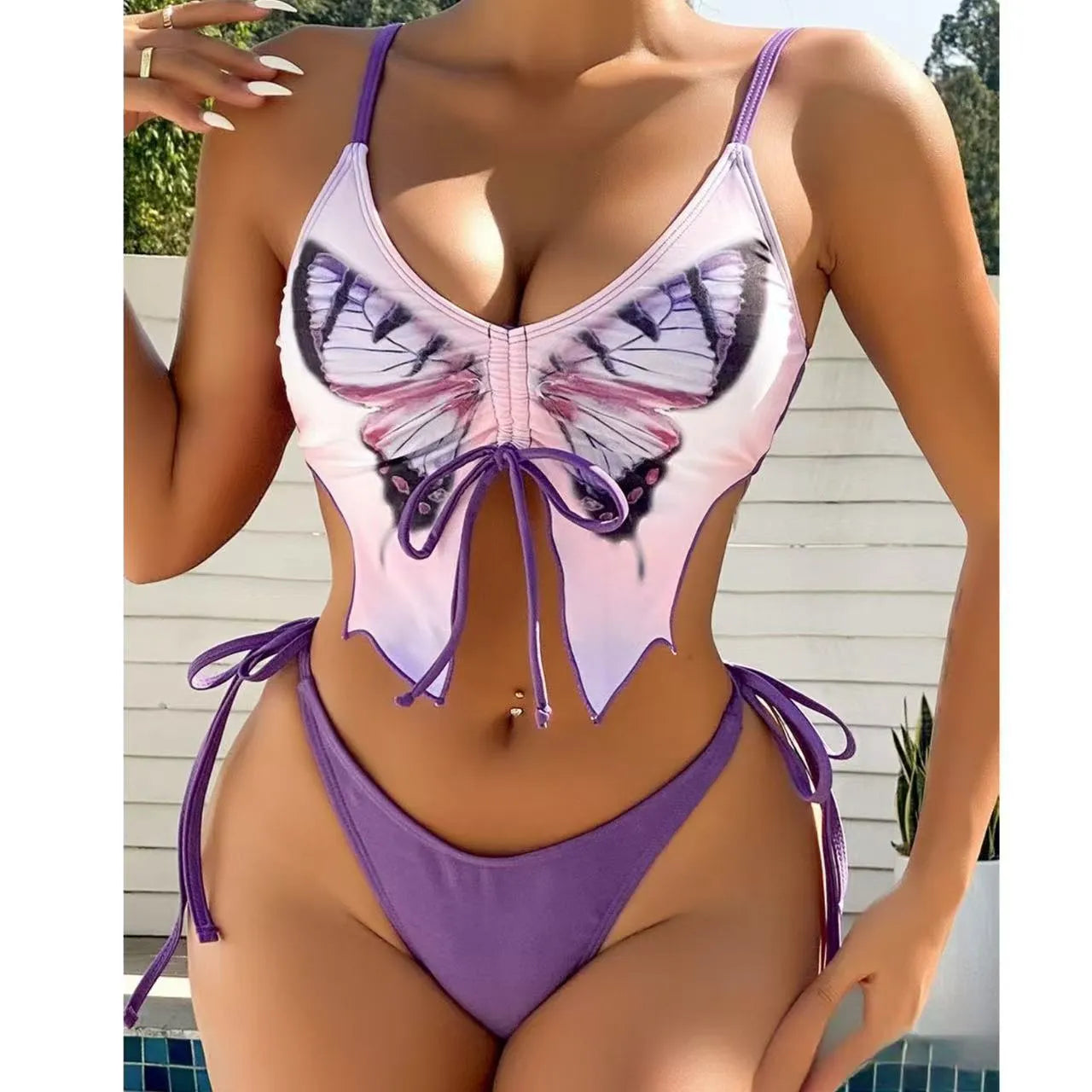 Women's purple bow ins style split bikini set with sleeveless top and briefs for swimming.
