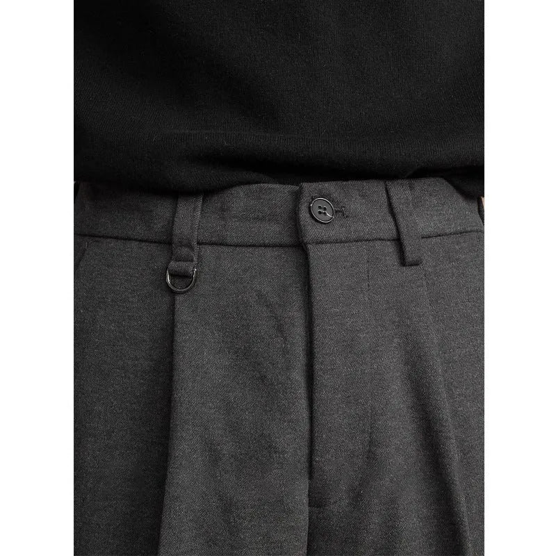 Men's straight-leg casual suit trousers in black, shown with a draped fit.