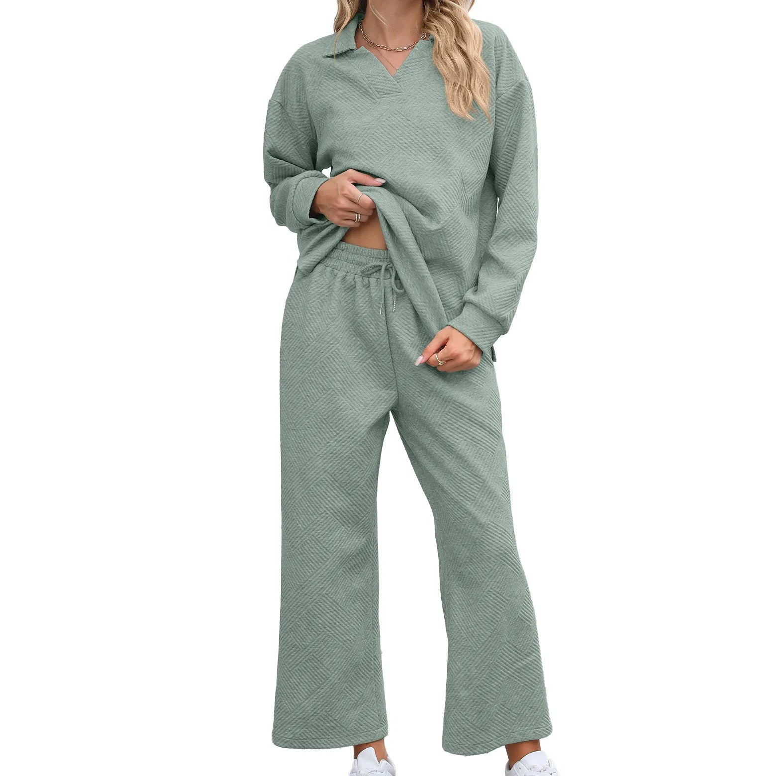 Women's solid colour rayon jacquard knit lapel sweater and elastic waist trouser set.