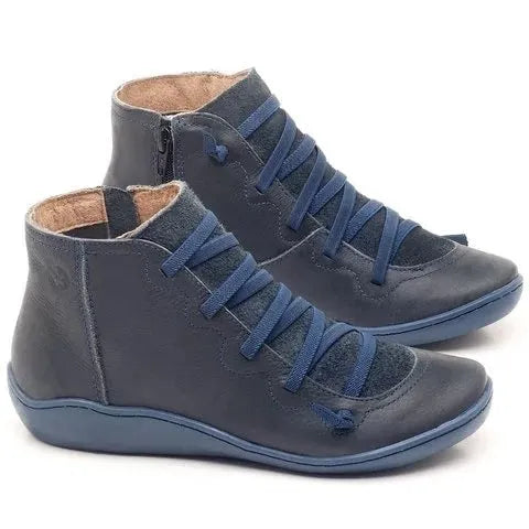 Women's casual ankle booties with a round toe, wedge heel, PU upper, and rubber sole in a selection of colours.