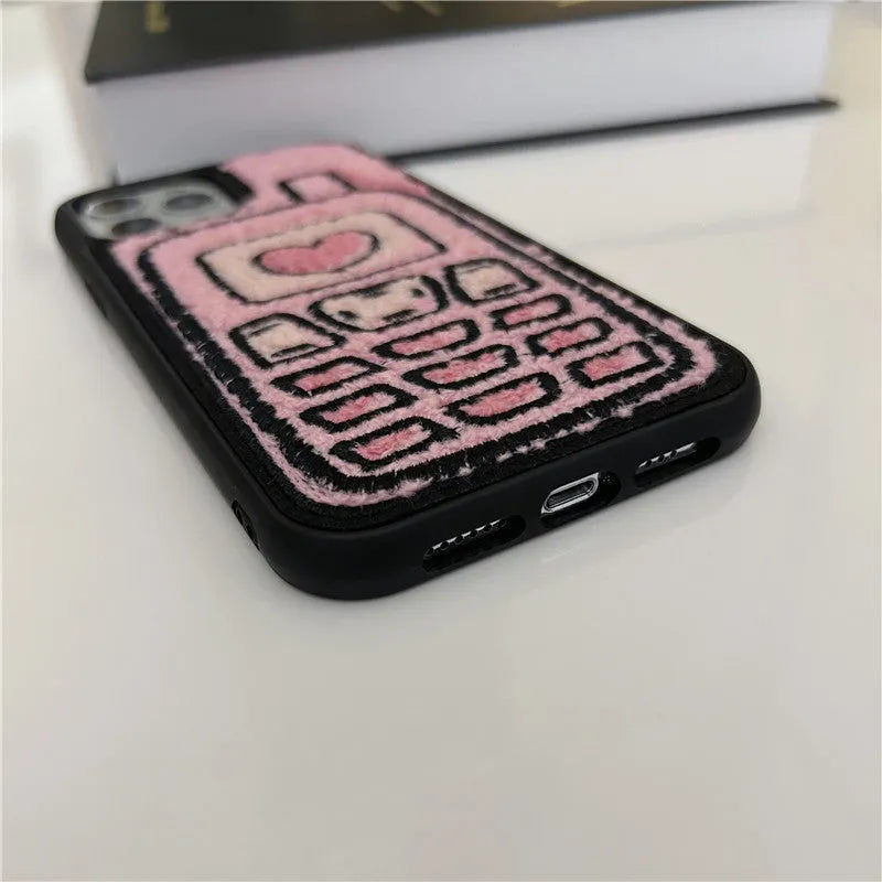 Pink towel embroidered TPU iPhone case showing textured surface on back cover.