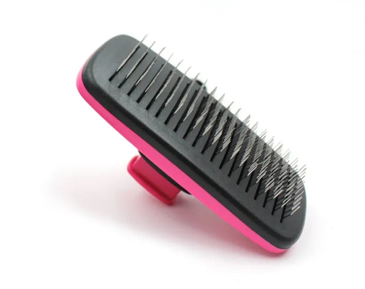 Automatic dehairing comb with stainless steel teeth and rose red handle, for dog and cat grooming, on a white background