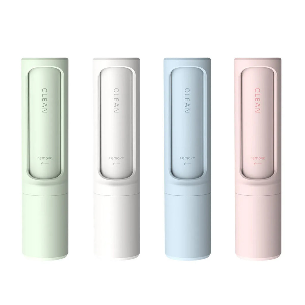 Rotating cylinder electrostatic pet hair removal brush in light pink with ABS body on a white background