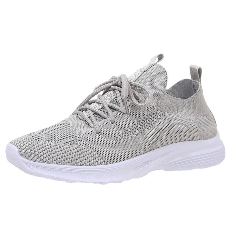 Women's Flyknit running shoes in Creamy White with mesh lining and rubber sole