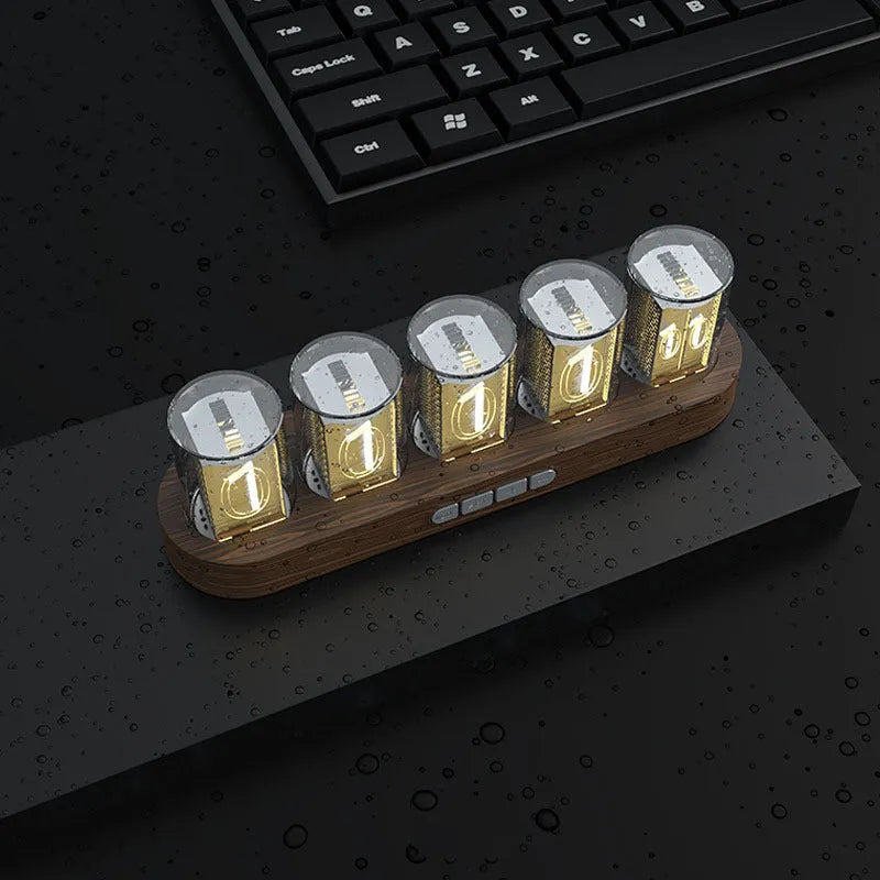 RGB LED digital clock showing colour-changing display on desk with black plastic casing