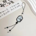 Guofeng ceramic bead pendant keychain with hand-painted Chinese fan and floral design.