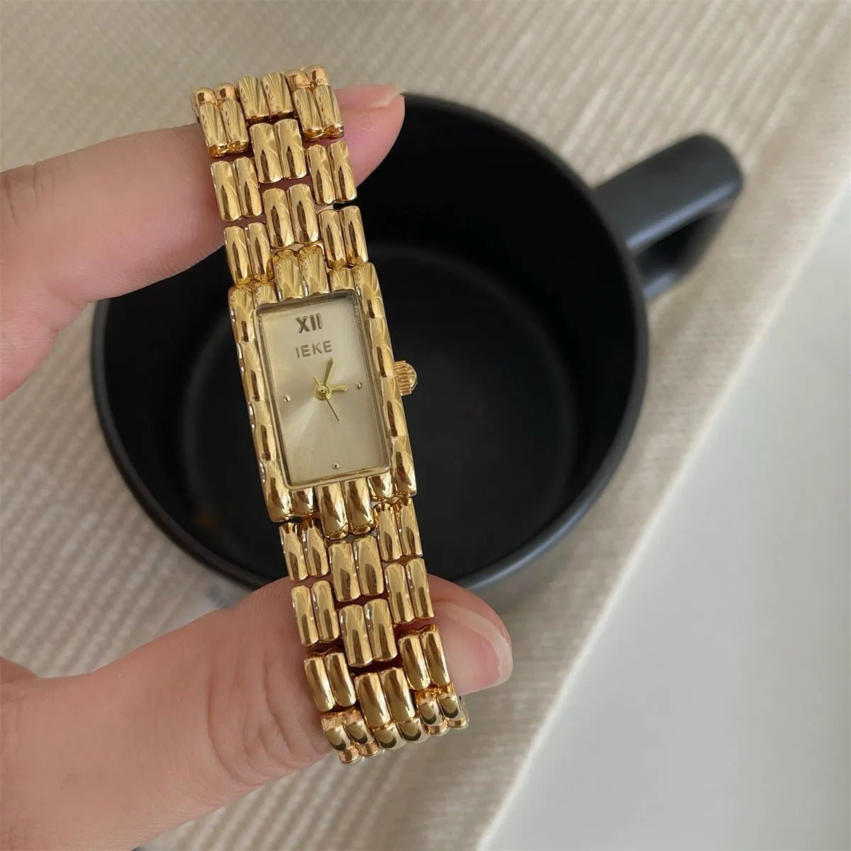 Women's antique-style bracelet watch with butterfly clasp in silver or gold with white or grey dial faces