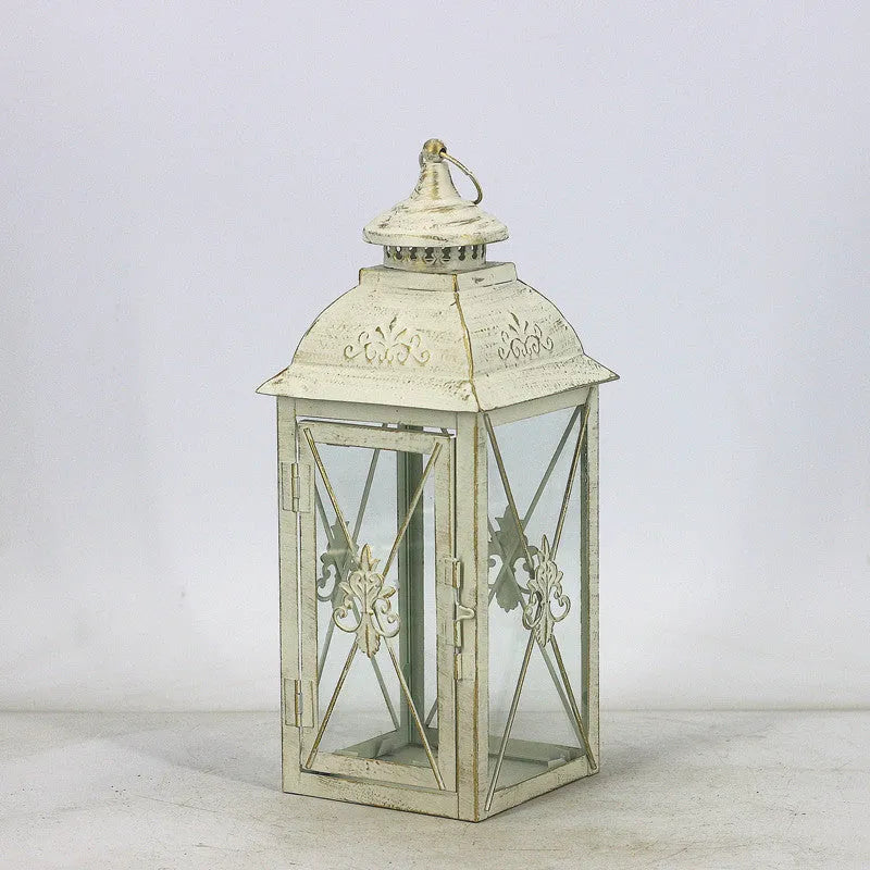 Black and white gold wrought iron storm lantern with tempered glass in three sizes for courtyard decoration.