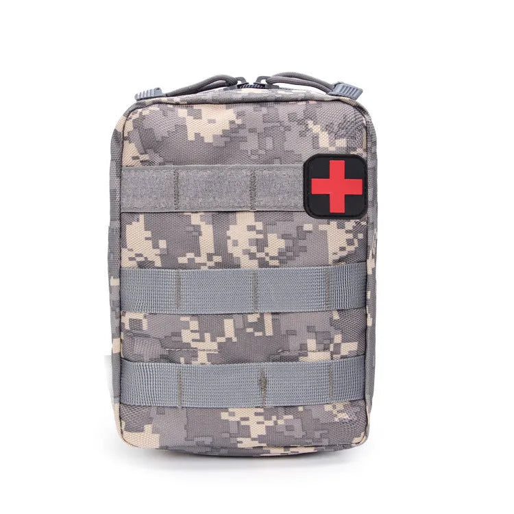 Army green nylon tactical medical accessory pouch with hook-and-loop fastening, shown next to a tape measure.