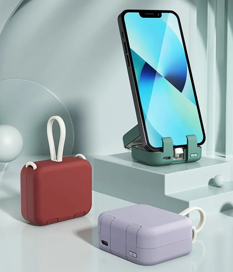 Multi-function bracket mobile power supply with dual cables in red, 4000mAh battery, phone holder built-in