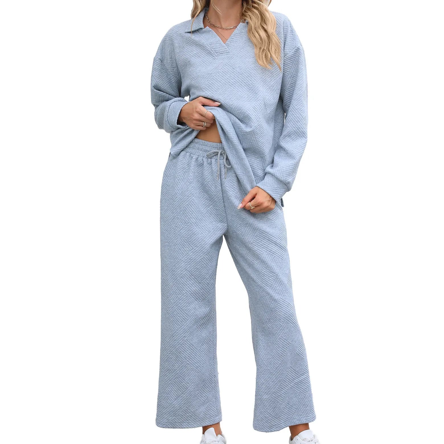 Women's solid colour rayon jacquard knit lapel sweater and elastic waist trouser set.