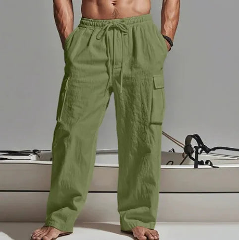 Men's loose cotton wide-leg casual trousers in light army green colour on a hanger.