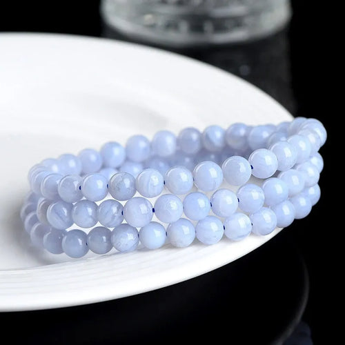 Blue agate bracelet with natural multi-circle pattern and Ruyi elements on wrist