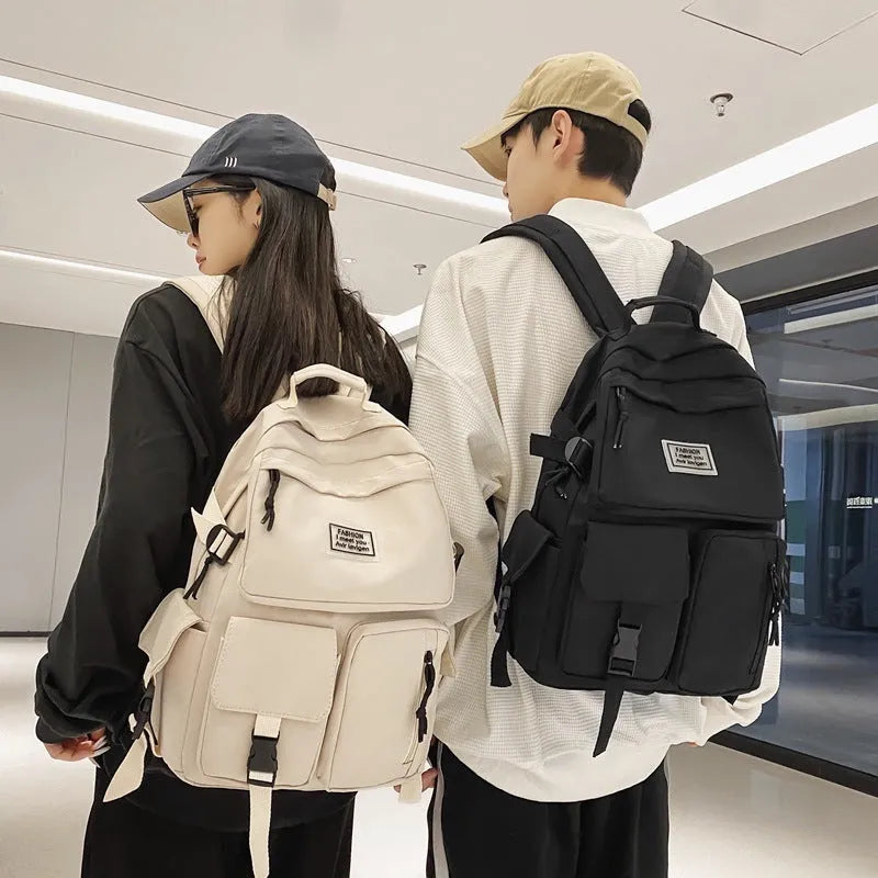 Black nylon student backpack showing laptop compartment and three-dimensional pockets
