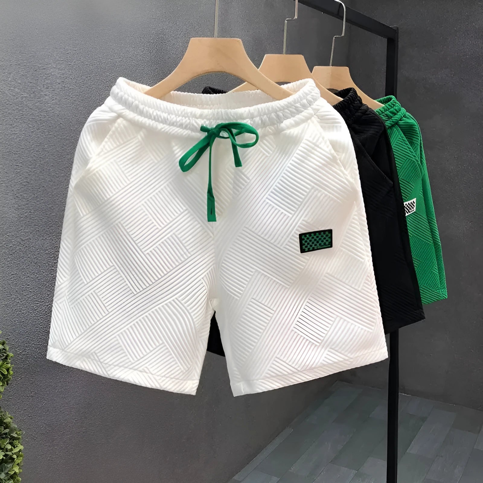 Casual polyester sports shorts with micro elasticity in black, white or green colours