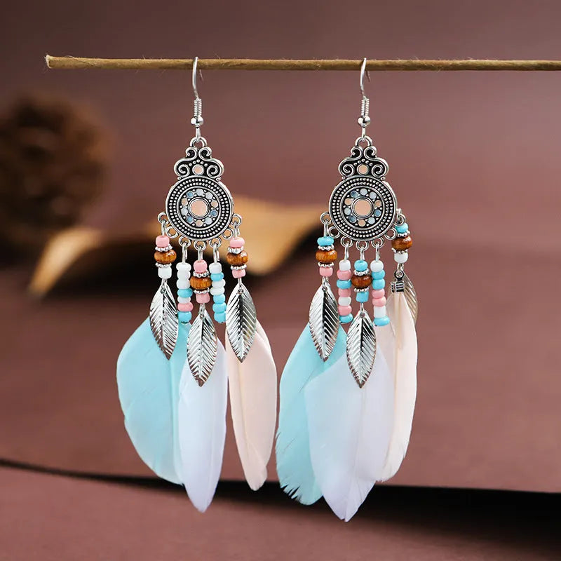 Round drop feather design alloy earrings with leaf pattern in a bohemian style, showing electroplated finish.