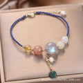 Women's hand-woven bracelet with peace buckle closure and crystal sequins in red, green, and blue colour options