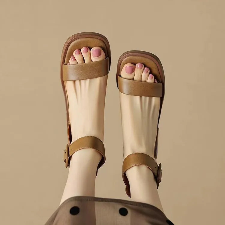 Women's white retro platform high heels with an ankle strap, shown from the side.