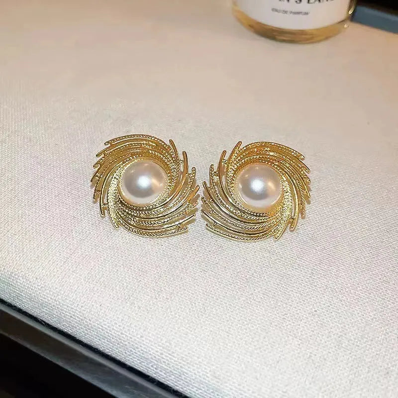 Flower shaped vintage earrings with exaggerated pearl centres and irregular design elements