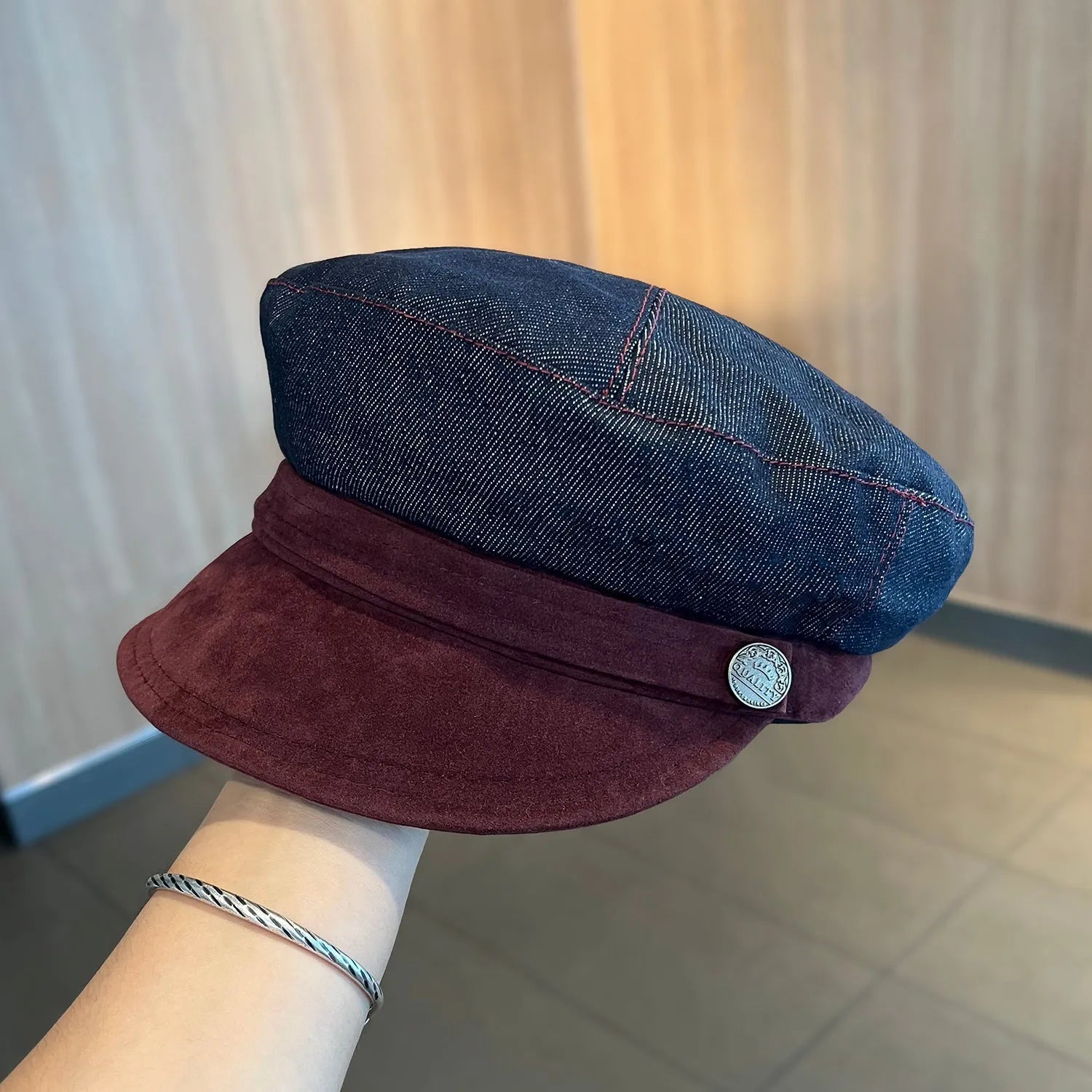 Dark blue denim octagonal newsboy hat with adjustable 54-58cm sizing and colour accent brim options