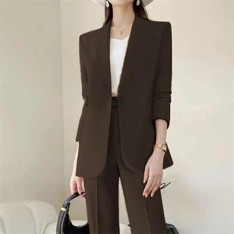 Women's polyester business suit set with blazer and trousers in beige, model standing