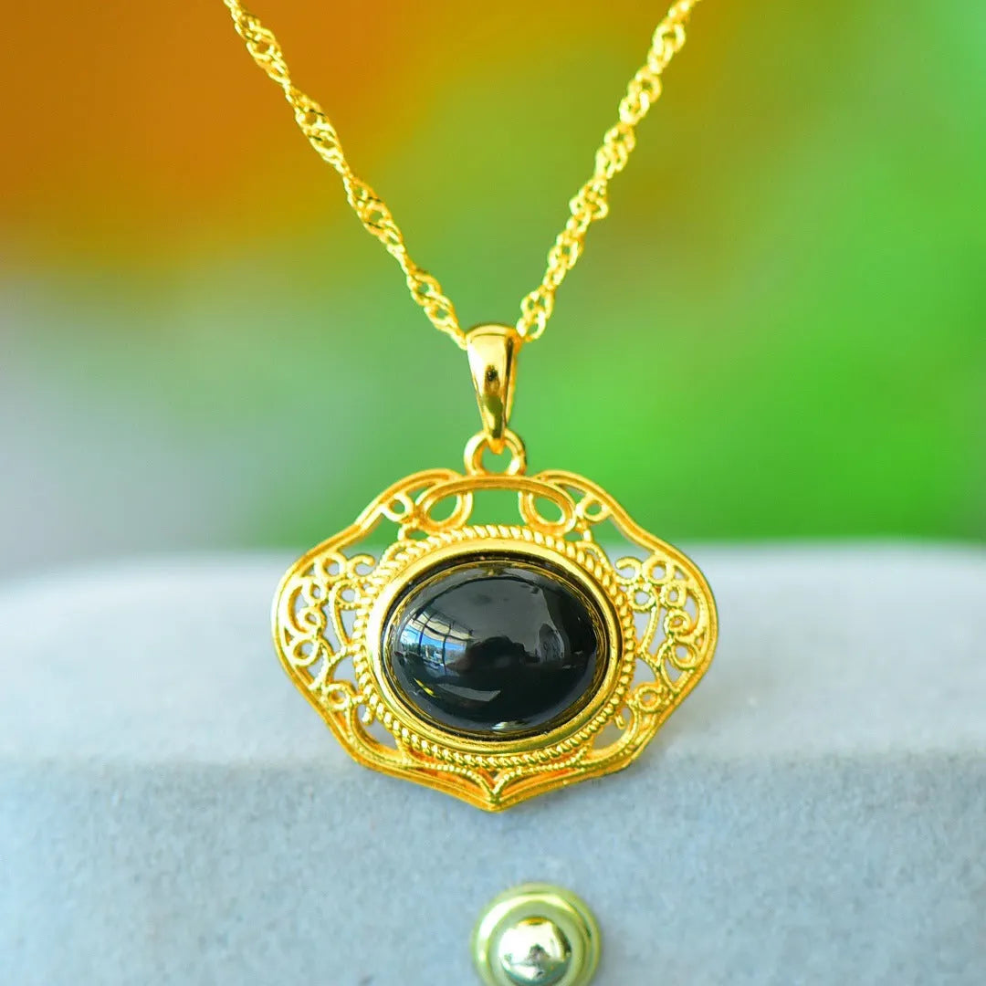 Copper inlaid natural Hetian gray and ink blue jade pendant necklace on a chain.