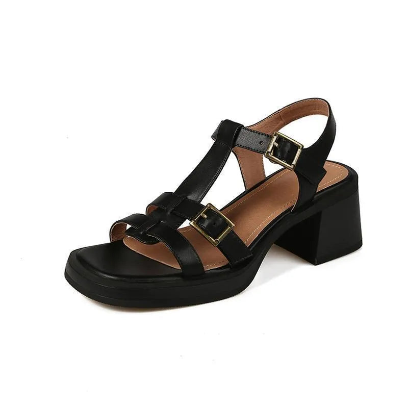 Black retro women's platform sandals with a T-buckle fastening and chunky heel.