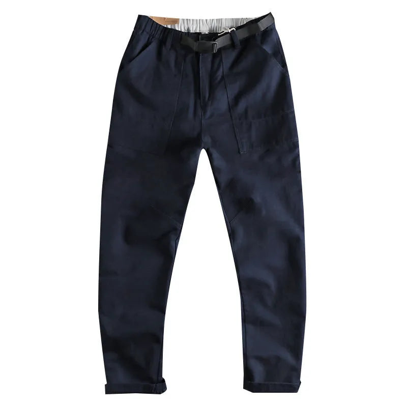 Men's khaki cotton work trousers showing N I buckle belt and three-dimensional cutting detail