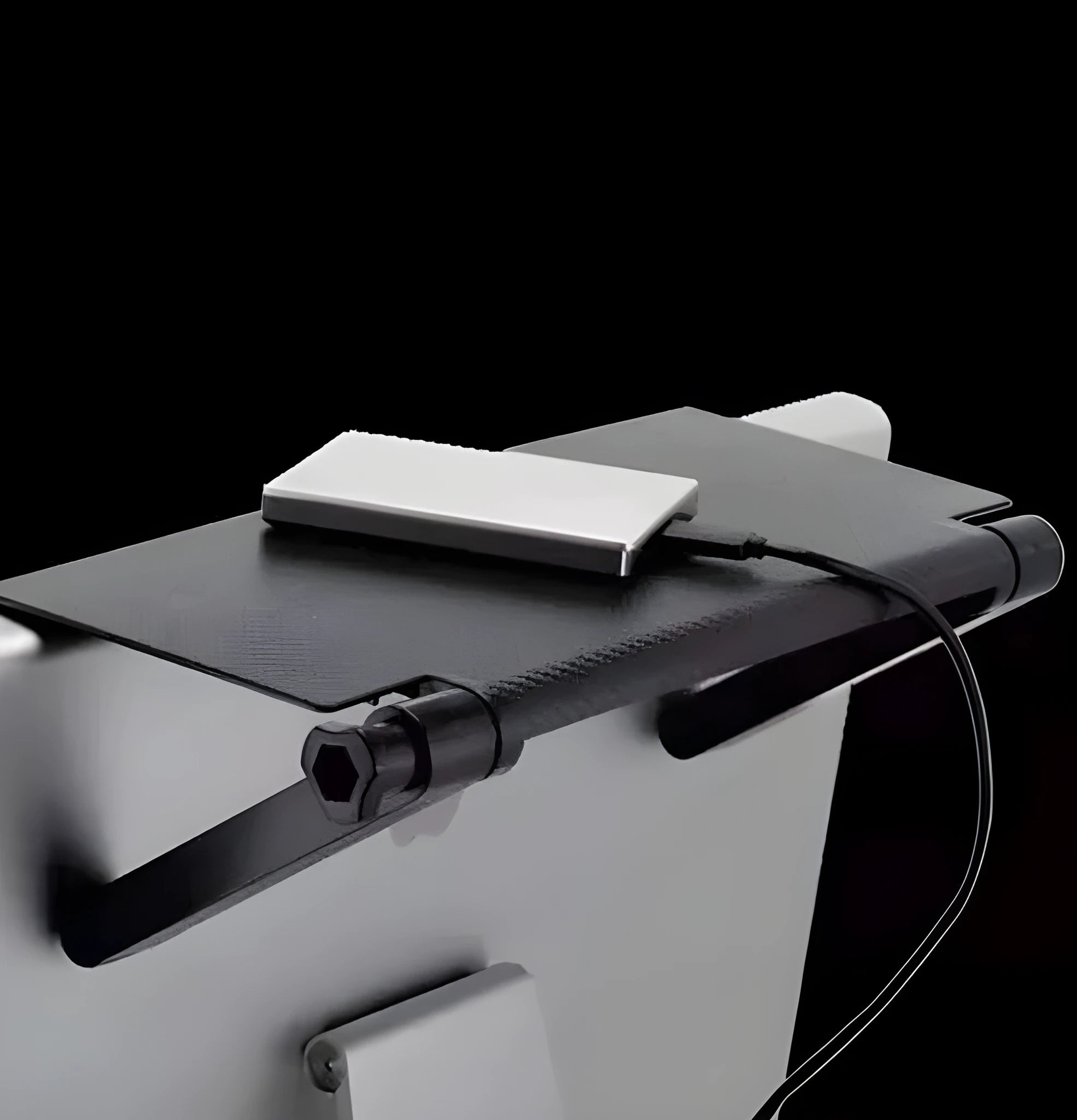 Adjustable black screen top shelf compatible with Apple TV and Roku, 13-inch size, on a computer monitor