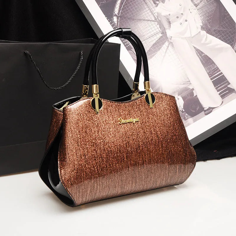 Women's medium horizontal square handbag with zipper closure and printed design, available in multiple colour options